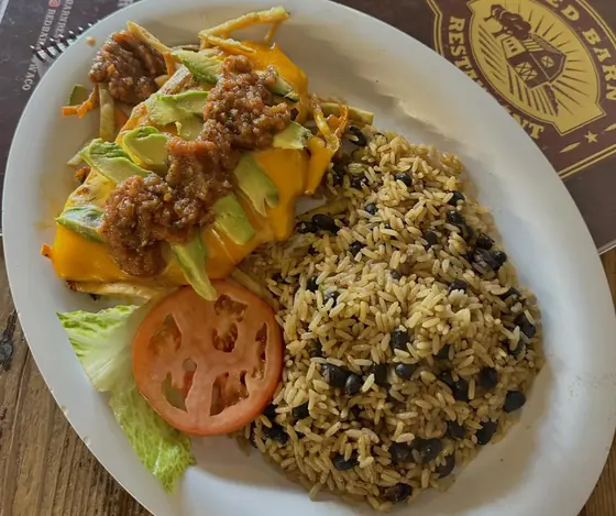 Scrambled eggs with rice, black beans, avocado and salsa