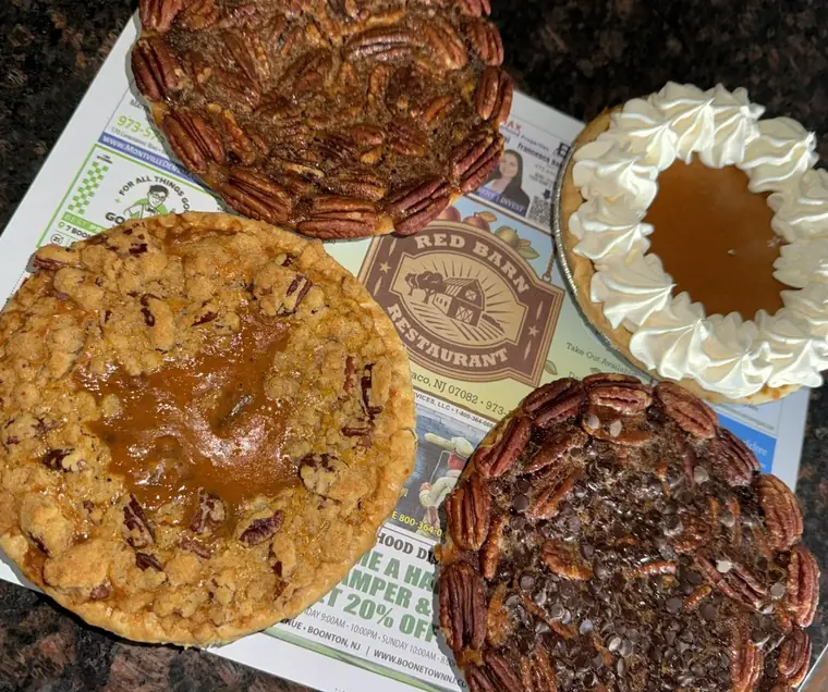 Homemade pecan, crumb and cream pies on the counter